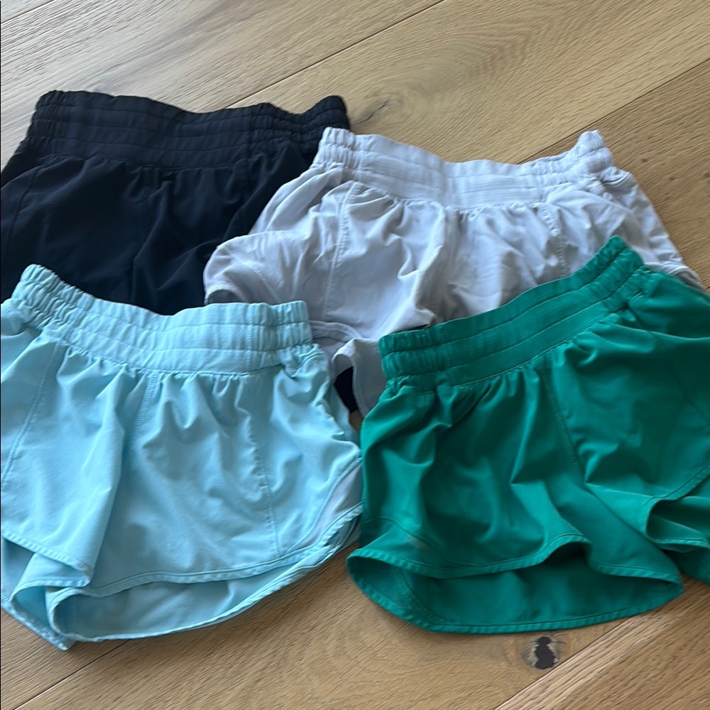 Set of Four lululemon Shorts in Black, White, Light Blue, and Green